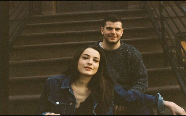 Lauren Norvelle in a dark blue denim jacket with her brother in a black sweater.